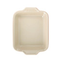 Beige interior of a Pyrex square baking dish isolated on white background.