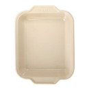 Beige rectangular Pyrex baking dish on a white background.