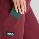 A close-up view of a pocket on a burgundy pair of Ridgeline women's infinity leggings.