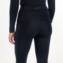 A woman wearing Navy Breeches on a grey background