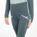 A child wearing petrol blue coloured breeches