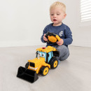 A child holding the remote control and operating the JCB Joey digger at home.