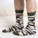 Someone wearing a green camo sock