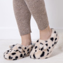 Someone wearing slippers designed to look like Dalmatians with 3D ears. Someone wearing slippers designed to look like Dalmatians with 3D ears.