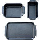 Three different-sized black baking trays arranged vertically on a white background.