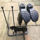 A boot rack with a horse silhouette holding two pairs of upside-down wellington boots.