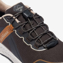 A close up of the laces on a cinder coloured trainer