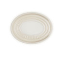 A cream oval spoon rest