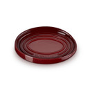 A dark red spoon rest