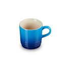 A blue cappuccino mug with Le Creuset branding
