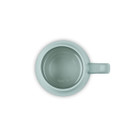 A light blue round mug from above