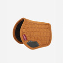 A dark yellow saddle pad against a white background.
