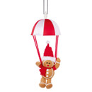 Hanging gingerbread Christmas tree decoration with a festive red and white parachute, featuring a smiling gingerbread figure wearing a Santa hat, suspended by a silver hanging loop.