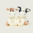 Two cow warmies, one with brown patches and the other with black patches.