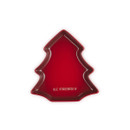 Red Le Creuset Christmas tree-shaped plate on a white background.