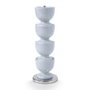 A stack of light blue egg cups on a silver base against a white background.