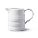 A white porcelain churn jug on a white background.