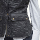 A close up of the pocket on the gilet with an embroidered Barbour logo