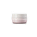 A light pink ramekin from the side