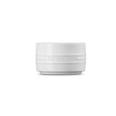 A white ramekin from the side