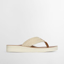 A side view of a sandal with a white crochet strap and white edging on the soles.