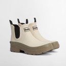 A pair of short cream wellington boots with a dusky green chunky sole and black elasticated side panels.