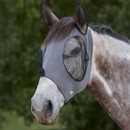 A horse wearing a grey protective mesh fly mask over its head.