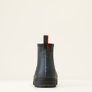 A single navy rubber boot is centred against a light beige background. The back view features a red pull tab, giving a minimalist, sturdy feel. A single navy rubber boot is centred against a light beige background. The back view features a red pull tab, giving a minimalist, sturdy feel.