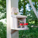 A side view of a timber squirrel feeder with a clear window and red stools for squirrels to sit on.