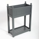 A grey wooden trough with a deep tray at the top and a shallow tray at the bottom against a white background.