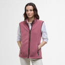 A woman wearing a pink fleece gilet