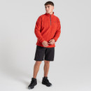 A front view of a man wearing a red quarter zip fleece