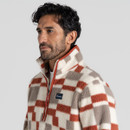 Close up front view of a man wearing a multicoloured quarter zip fleece