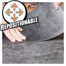 Hands peeling away a grey adhesive layer labelled "REPOSITIONABLE" with arrows indicating movement.