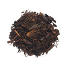 A pile of rich dark brown organic mulch isolated on a white background.