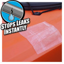 Adhesive tape on orange surface labelled "STOPS LEAKS INSTANTLY," covering a crack.