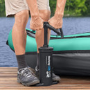 A view of someone using a black hammer air hammer on decking