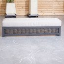 A close up of the cushioned bench