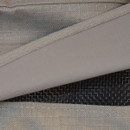 A close up view of a grey garden furniture cover with an air vent
