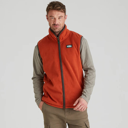A front view of a man wearing an orange Ridgeline fleece gilet