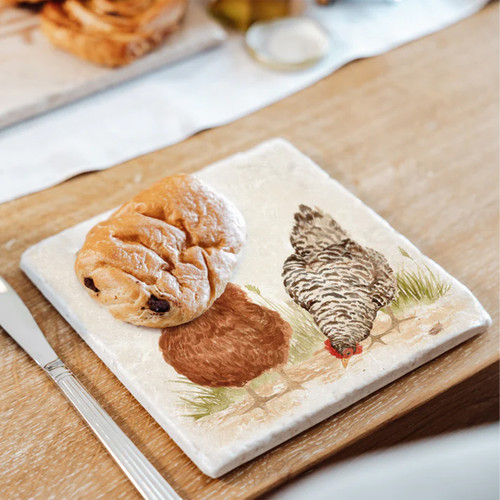 A view of a medium marble platter with chickens on it