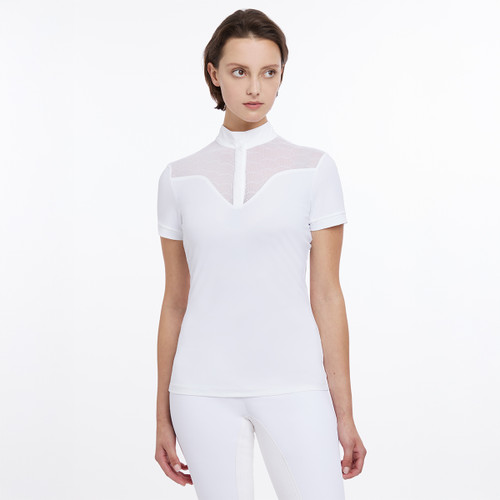 A woman models a stylish white short-sleeve top featuring a structured collar and mesh detailing, paired with matching white pants.