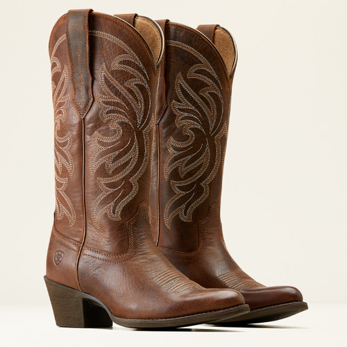 A pair of brown leather cowboy boots featuring intricate floral stitching and a stacked heel, showcased against a plain background.