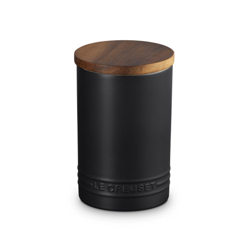 A black storage jar with wooden lid.