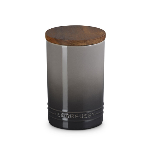 A grey stoneware jar with a wooden lid.