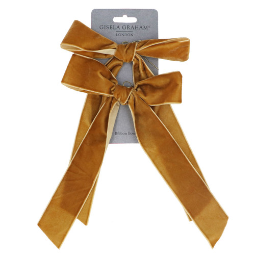 A pack of two gold velvet bows