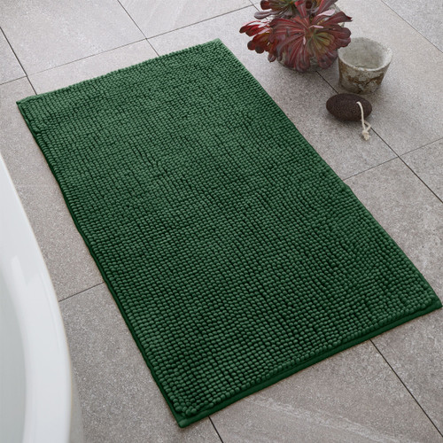A view of a green Catherine Lansfield Bobble Bath Mat on a tiled floor