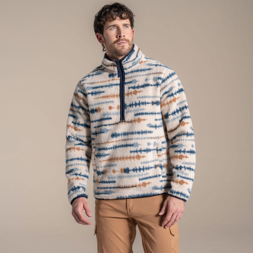 Man wearing beige fleece pullover with blue and brown striped pattern, quarter zip, and high collar. Man wearing beige fleece pullover with blue and brown striped pattern, quarter zip, and high collar.