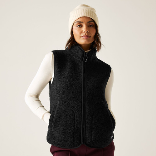 A woman wearing a black borg gilet.