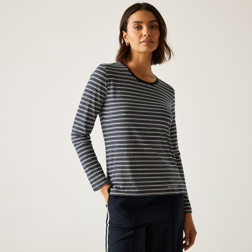 A woman wearing a long sleeved, navy and vanilla coloured, striped top.